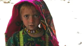 Pashai_girl_in_Afghanistan,_wearing_distinctive_Pashai_clothing